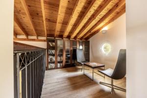 a home office with a wooden ceiling at Rhodia Villa in Ayios Isidhoros