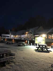 a group of picnic tables in front of a inn at night at Half Moon Jackfield in Bridgnorth +29 photos