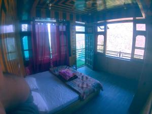 Postel nebo postele na pokoji v ubytování Holy apple