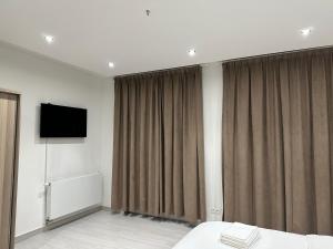 Μια τηλεόραση ή/και κέντρο ψυχαγωγίας στο Luxurious Apartment