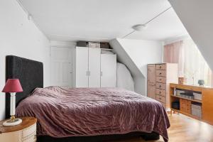 Ένα ή περισσότερα κρεβάτια σε δωμάτιο στο Klockargården Örja byväg 17