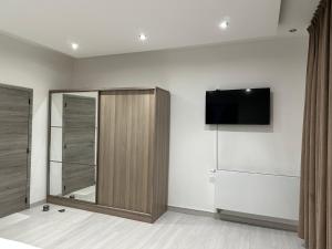 Μια τηλεόραση ή/και κέντρο ψυχαγωγίας στο Luxurious Apartment