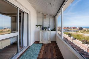 a balcony with a view of the ocean at Charming Beachside Escape in Esmoriz +34 photos