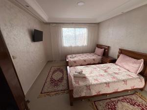 Postel nebo postele na pokoji v ubytování VILLA Dar BOUAZZA, Vue sur mer, 200m de la plage + 29 fotografií