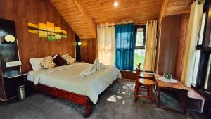 Postel nebo postele na pokoji v ubytování Utopia Hostel Dharamkot Mcleodganj