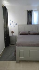 Ένα ή περισσότερα κρεβάτια σε δωμάτιο στο Rosanna