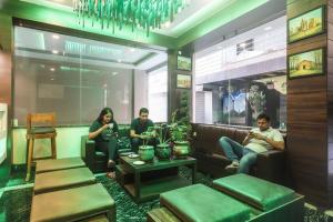 a group of people sitting in a waiting room at Via Ganpati 2 - Nr Siliguri Junction in Siliguri