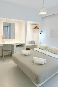 Una cama o camas en una habitación de Erice Fira