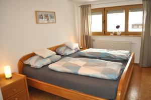 En eller flere senge i et værelse på Mayers Urlaubsnest