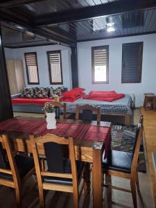 a dining room with a table and a bed at Baile Figa-Terasa Spa Cazare in Agrişu de Sus +25 photos