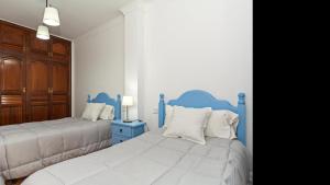 En eller flere senge i et værelse på Playa Blanca Sea & Heart Apartment BY PVL