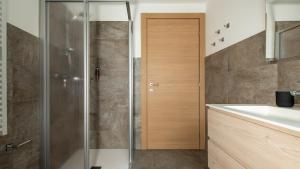 a bathroom with a shower and a sink at Zardin 7 in Valdidentro +17 photos