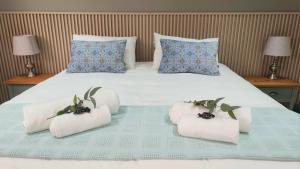 Una cama o camas en una habitación de Mia Nina