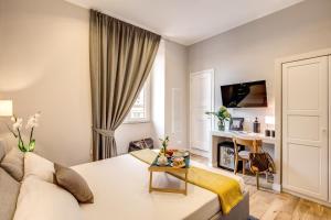 a living room with a couch and a table at The Club Navona in Rome