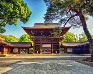 a large building with a tree in front of it at New mansion 7 mins from Yoyogi stations in Tokyo