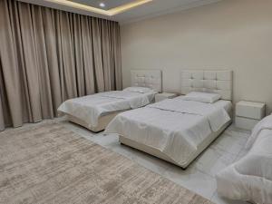 Postel nebo postele na pokoji v ubytování Suites OrbitNet JED2M