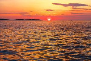 a sunset over a large body of water at DOME Hotel & Casino Central Kyrenia ! in Kérynia +37 photos