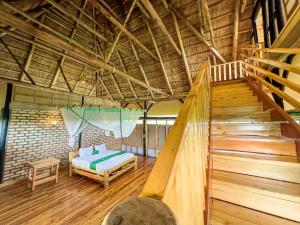 Postel nebo postele na pokoji v ubytování Egret safari lodge + 12 fotografií