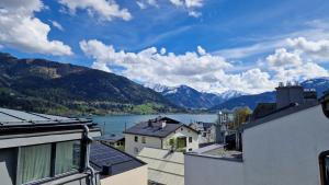 a view of a body of water and mountains at Penthouse Mountain and Lake View, terrace, AirCondition, incl Summer Card in Zell am See