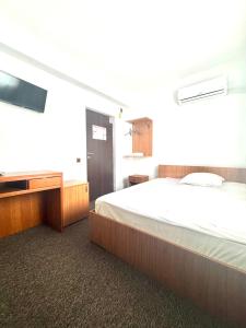 Кровать или кровати в номере Casa de Piatra Bistro