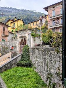 a view from a window of a city with buildings at Casa colore intera casa nel borgo antico in Ossuccio