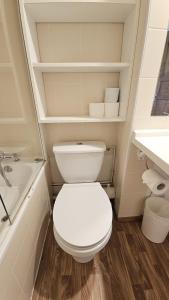 a bathroom with a white toilet and a sink at Val Thorens - Ski InOut - 4 Beds Flat C-E19 in Béranger