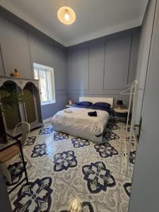 En eller flere senge i et værelse på Palazzo Rubina - Dimora mediterranea & SPA