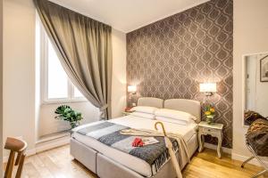 a hotel room with a bed and a window at The Club Navona in Rome