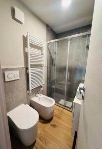 a bathroom with a toilet and a sink and a shower at Lift Hotel in Sauze d'Oulx