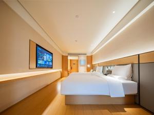 Postel nebo postele na pokoji v ubytování JI Hotel Chengdu East Railway Station Greenland 468 + 27 fotografií