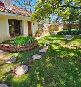 a yard with a bench in front of a house at Home with The Hoffs in Smithfield