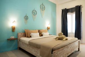 Postel nebo postele na pokoji v ubytování The White Bay Lombok + 28 fotografií