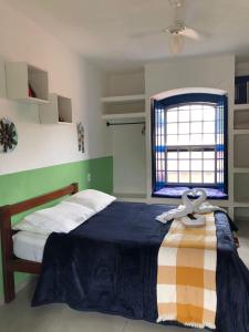 Postel nebo postele na pokoji v ubytování Brisa da Praia Colonial