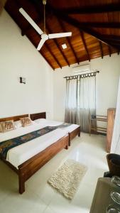 Ένα ή περισσότερα κρεβάτια σε δωμάτιο στο Sritaly Inn