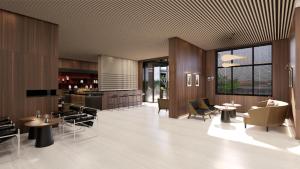 a restaurant with tables and chairs and a bar at Intercity Hotel & Serviced Apartment Phnom Penh Downtown in Phumĭ Prêk Chrey