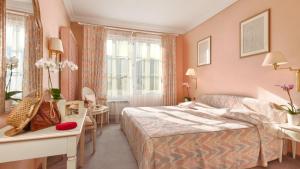Ліжко або ліжка в номері Hotel Tamaro