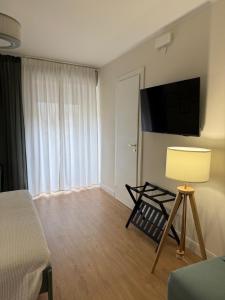 TV a/nebo společenská místnost v ubytování Casa Rosina