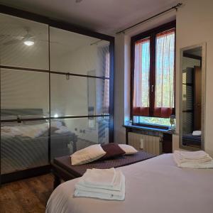 Postel nebo postele na pokoji v ubytování la gardenia gallarate vacation home