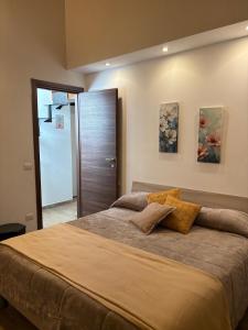 Giường trong phòng chung tại San Martino Guest House Sunlight