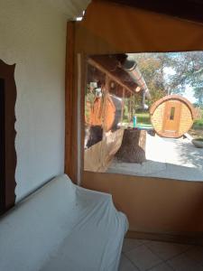 a view of a room with a mirror and a bed at Jakuzzis,Szaunás,Kerkavendégház-Őrség-Csesztreg-Kerkaujfalu in Csesztreg