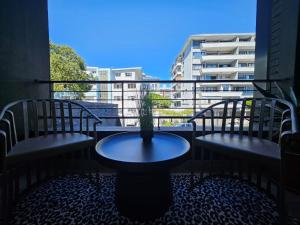 En balkon eller terrasse på FOUR on O -Fluent Serviced Apartments