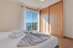 Ένα ή περισσότερα κρεβάτια σε δωμάτιο στο Casa da Laranja by Holiday Rental Madeira +26 φωτογραφίες