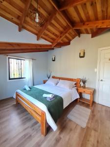 Postel nebo postele na pokoji v ubytování Nido Del Bosque