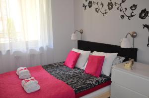 Posteľ alebo postele v izbe v ubytovaní Apartamenty Szczęśliwe Sny