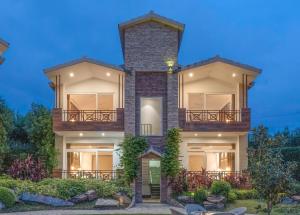 a rendering of a house at night at Trinantara Resort & Spa in Kālāgarh