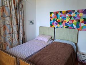 Ένα ή περισσότερα κρεβάτια σε δωμάτιο στο teatro ariston camera privata