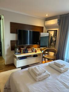 Ένα ή περισσότερα κρεβάτια σε δωμάτιο στο Quarto estilo loft