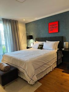 Ένα ή περισσότερα κρεβάτια σε δωμάτιο στο Quarto estilo loft