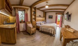 a bedroom with a bed and a sink in a room at Chata Škerda - Zuberec in Zuberec