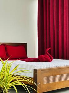 En eller flere senge i et værelse på Pearl Beach